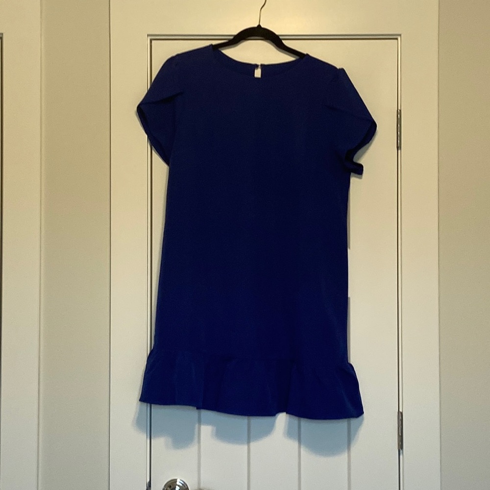 Adorable tulip sleeved bright blue dress with ruffle bottom.